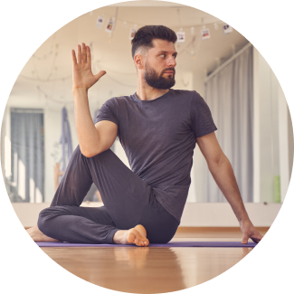 A man demonstrating yoga asana during art of livings happiness program